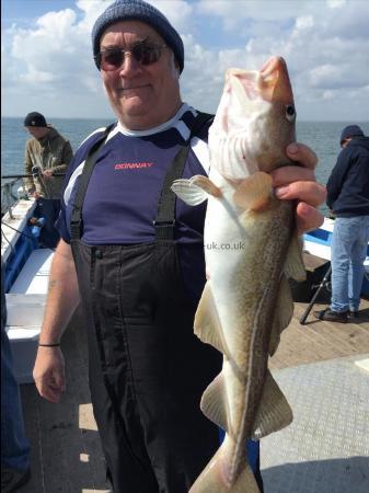8 lb Cod by mogger aboard HEIDI J netting another cod 16th may