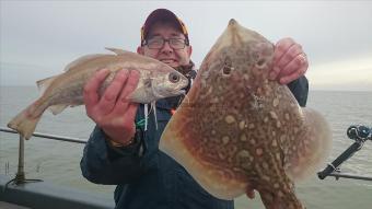 1 lb 10 oz Poor Cod by It was when we caught it!!! (poor cod!)