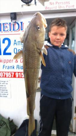 7 lb 6 oz Cod by merlin goacher shows his father how to catch fish