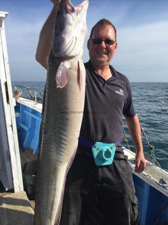 18 lb Ling (Common) by Dave birkett  holding up an 18lb ling FISHING WEEK