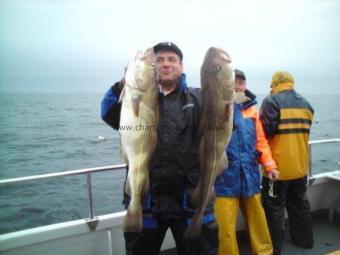 16 lb Cod by one of the guys with a pair of cod