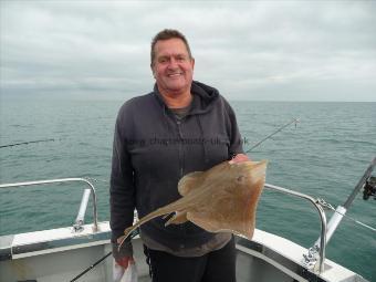 1 lb 14 oz Spotted Ray by Dennis with another small spotted