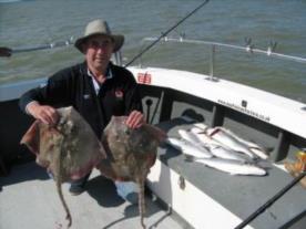 13 lb Thornback Ray by John Goddard with his skate and bass